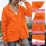 PESION Women’s Waterproof Raincoat Lightweight Rain Jacket Hooded Windbreaker, Orange XX-Large