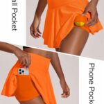 PINSPARK Women Athletic Skirt with 2 Pockets A Line Tennis Skirts with Shorts Underneath Cute Exercise Skorts, Orange Medium