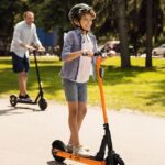 QnQ Electric Scooter 500W Peak Motor, 12 Miles Range & 15 MPH, 8″ Flat-Free Tires, UL Certified, Foldable Electric Scooter for Adults, Teens and Big Kids (Orange)